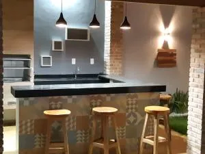 CASA COM PISCINA no CENTRO - Nova Viçosa