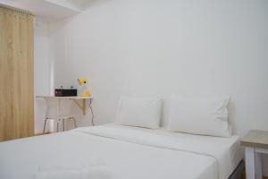 New Furnished with Cozy Stay Studio Apartment at M-Town Residence By Travelio