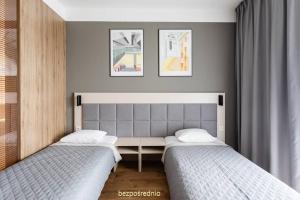 Apartament w Warszawie dedykowany parking podziemny w cenie, WiFi, AC, blisko centrum New apartment in Warsaw finished to a high specification fitted out to a high standard on the 7th floor, WiFi, underground parking price included