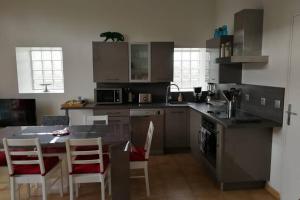 Appartements Les ecuries du chateau : photos des chambres