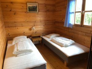 Semestra i timmerstuga