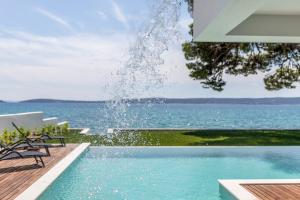 Beachfront Villa with Heated Infinity Pool and Direct Sea Access Kastela near Split