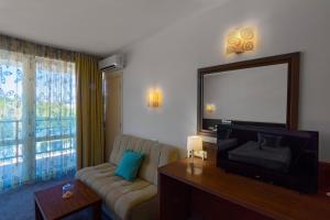 Family Room (3 Adults + 1 Child) room in Hotel Glarus Beach