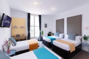 Quadruple Room with Balcony room in Amra Barcelona Caspe