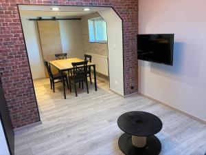 Appartements Logements equipes a Onnaing avec espace Balneo en OPTION proche Toyota, autoroute et Valenciennes : photos des chambres