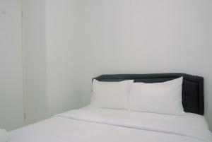 Cozy Living 2BR Apartment at Bassura City near Mall By Travelio