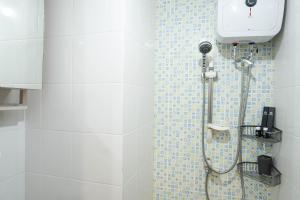 Cozy and Modern Studio Apartment at Belmont Residence Puri By Travelio