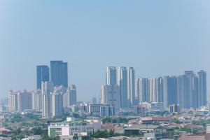 Cozy and Modern Studio Apartment at Belmont Residence Puri By Travelio