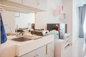 Cozy and Relax Studio Room at Tree Park City BSD Apartment By Travelio