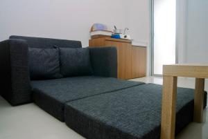 2BR Fully Furnished Minimalist Bassura City Apartment By Travelio