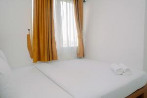 Comfortable and Fully Furnished 2BR Bassura City Apartment By Travelio