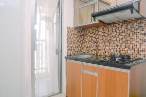 Comfortable and Fully Furnished 2BR Bassura City Apartment By Travelio