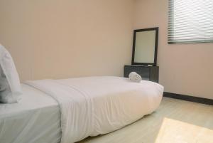 Homey and Relaxing 2BR The Wave Apartment By Travelio