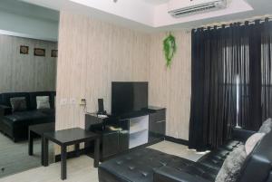 Homey and Relaxing 2BR The Wave Apartment By Travelio