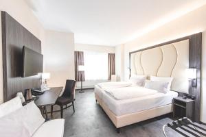 Deluxe Quadruple Room with One Double and Two Single Beds room in Best Western Plaza Hotel Mannheim