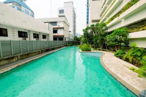 Pool View 2BR Apartment at Capitol Park Residence By Travelio