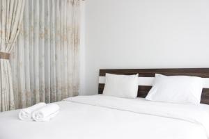 Pleasant 1BR Apartment with Sofa Bed at Dago Suites By Travelio