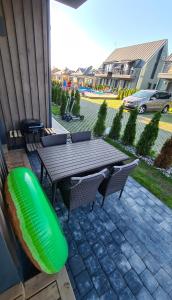 Vaivorykštės 7D apartamentai su baseinu vasaros metu