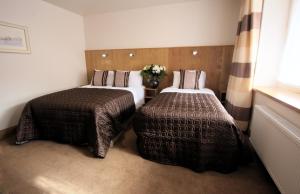 Double and Single Bed Room room in Blooms Hotel
