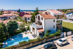 Villa Andrija Family Dream with heated pool at the sea with beautiful garden, outside cinema and kids playground