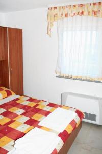 Two-Bedroom Apartment with Terrace and Sea View room in Apartments with a swimming pool Caska Pag - 4109