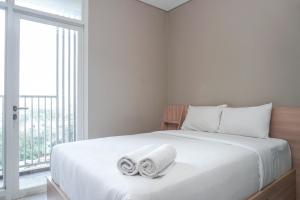 Comfortable Design Studio Apartment Ciputra International By Travelio