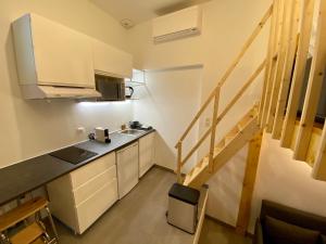 Appartements L'Atypique - Au Coeur d'Agen - Self Checkin - Wifi - Netflix - Smart TV - Luqs fr : photos des chambres