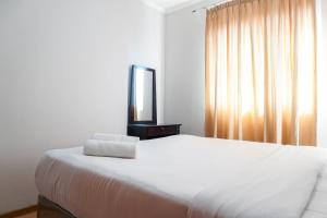 Simply 1BR Grand Palace Kemayoran Apartment By Travelio