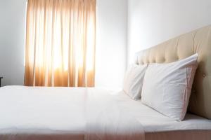 Simply 1BR Grand Palace Kemayoran Apartment By Travelio