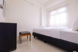 Cozy 2BR at 28th Floor Green Pramuka City Apartment By Travelio
