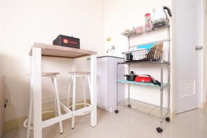 Cozy 2BR at 28th Floor Green Pramuka City Apartment By Travelio