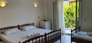 Triple Room with Garden View room in Artemis Hotel