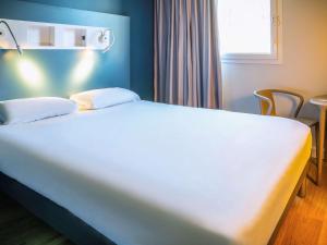 Hotels ibis budget Reims Parc Des Expositions : photos des chambres