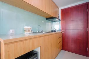 Modern Style Studio Tamansari Mahogany Karawang Apartment with City View By Travelio