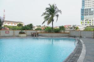 Modern Furnished @ 1BR Margonda Residence 1 Apartment By Travelio