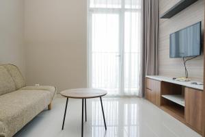 Comfortable Design 1BR Apartment Ciputra International By Travelio