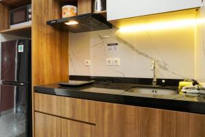 Comfortable Design 1BR Apartment Ciputra International By Travelio