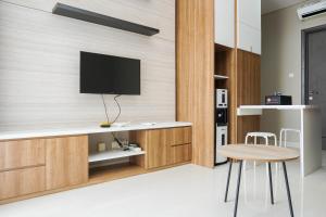 Comfortable Design 1BR Apartment Ciputra International By Travelio