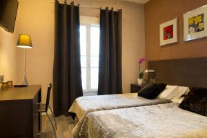 Hotels Hotel des Arceaux : photos des chambres