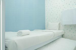 Best Comfy and Modern 2BR Green Pramuka Apartment By Travelio