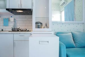 Best Comfy and Modern 2BR Green Pramuka Apartment By Travelio