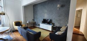 Appartements L'Ecu : un Haussmannien accueillant! : photos des chambres