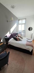 Appartements L'Ecu : un Haussmannien accueillant! : photos des chambres