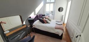 Appartements L'Ecu : un Haussmannien accueillant! : photos des chambres