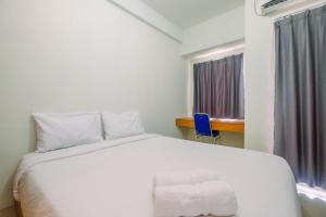 Simply Look Studio Tamansari Mahogany Karawang Apartment By Travelio