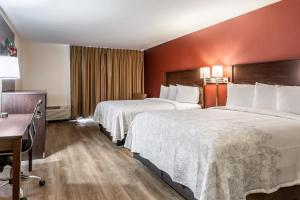 Deluxe Queen Room with Two Queen Beds - Smoke Free room in Red Roof Inn PLUS+ & Suites Houston – IAH Airport SW