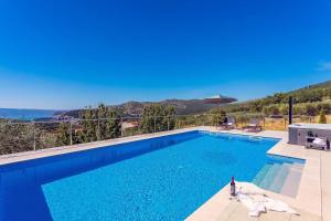 Villa Flora with a 53 sqm private pool with Cinema room with projector and 4 en-suite bedrooms