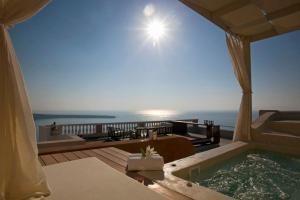 Villa room in Luxury Santorini Villa Sunset Villa Jacuzzi Panoramic SunsetSea View 4 BDR Oia
