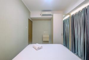 Comfortable and Spacious 2BR at Oasis Cikarang Apartment By Travelio