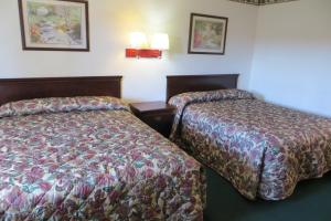 Queen Room with Two Queen Beds room in Capri Motel